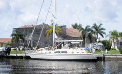 Water depths, canal system layout, and canal exits to the harbor are all important considerations when buying a sailboat-access home or lot.